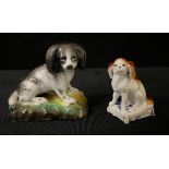 A mid 19th century Continental Porcelain model, of a King Charles Spaniel, 4cm high, c.1850;