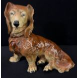 A Karl Ens model, of Long Haired Dachshund, 21.5cm high, printed mark