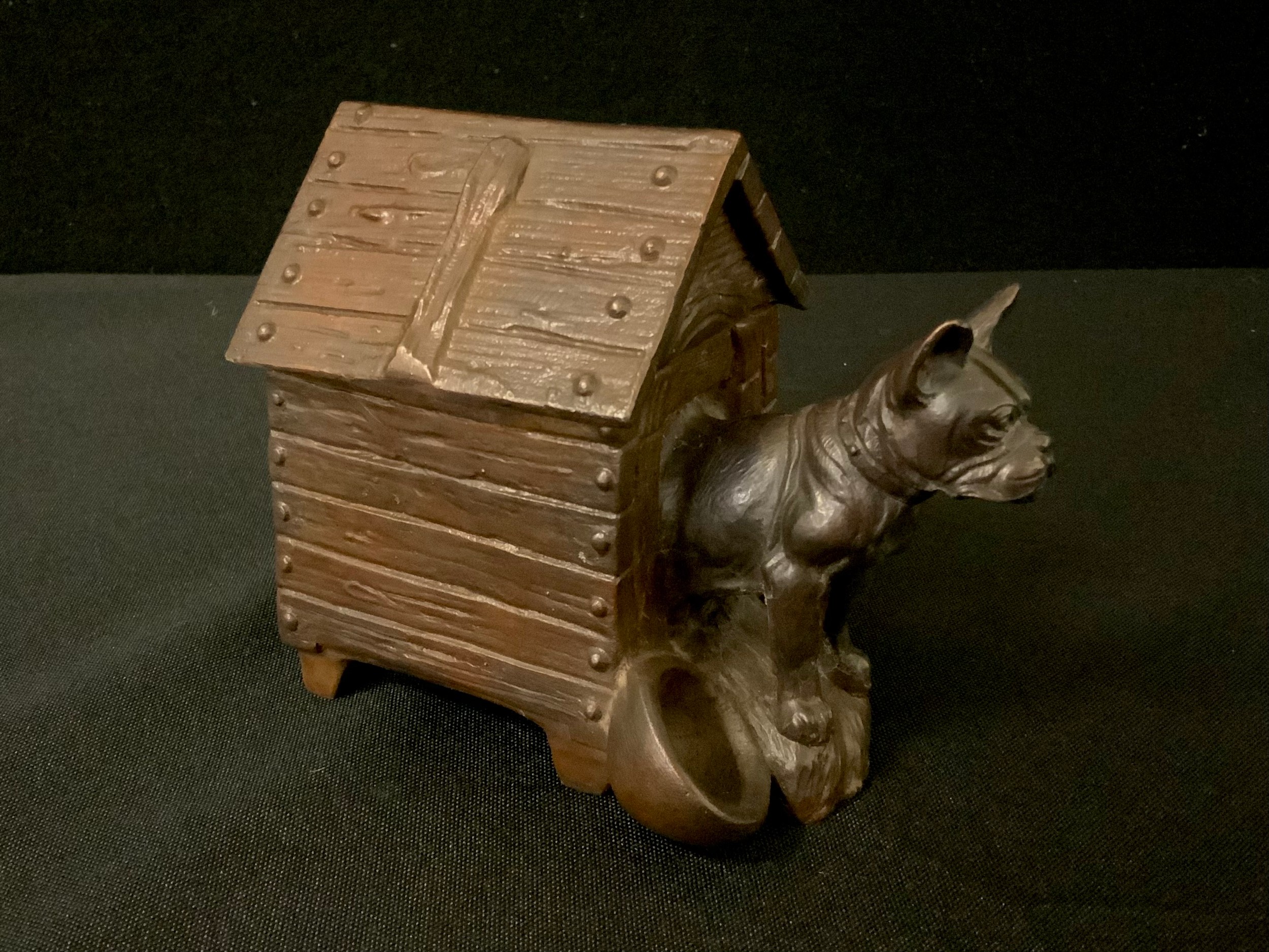 A 20th century bronzed novelty inkwell, cast with Bulldog, in a kennel, 11cm high