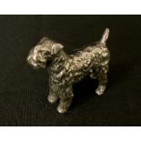 A silvered metal model, possibly a car mascot, as a Kerry Blue Terrier, 5.5cm high, c.1930