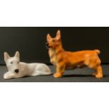 A Royal Doulton model, of a Bull Terrier, in the white, 6cm wide, printed mark; another, Welsh