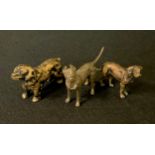 An early 20th century black patinated bronze model, Spaniel, 5.7cm long; others possibly Doberman