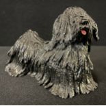 An Eve Pearce pottery model, of a Hungarian Puli, 11cm high, impressed initials