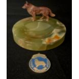 An early 20th century Austrian cold painted spelter Rough Collie, standing, on circular onyx pin