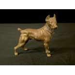 An Austrian gilt bronze model, of a Dobermann Pinscher, standing, 8.5cm high, c.1930