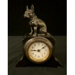 An early 20th century German clock, Arabic numerals, surmounted with a French Bulldog, 15cm high,