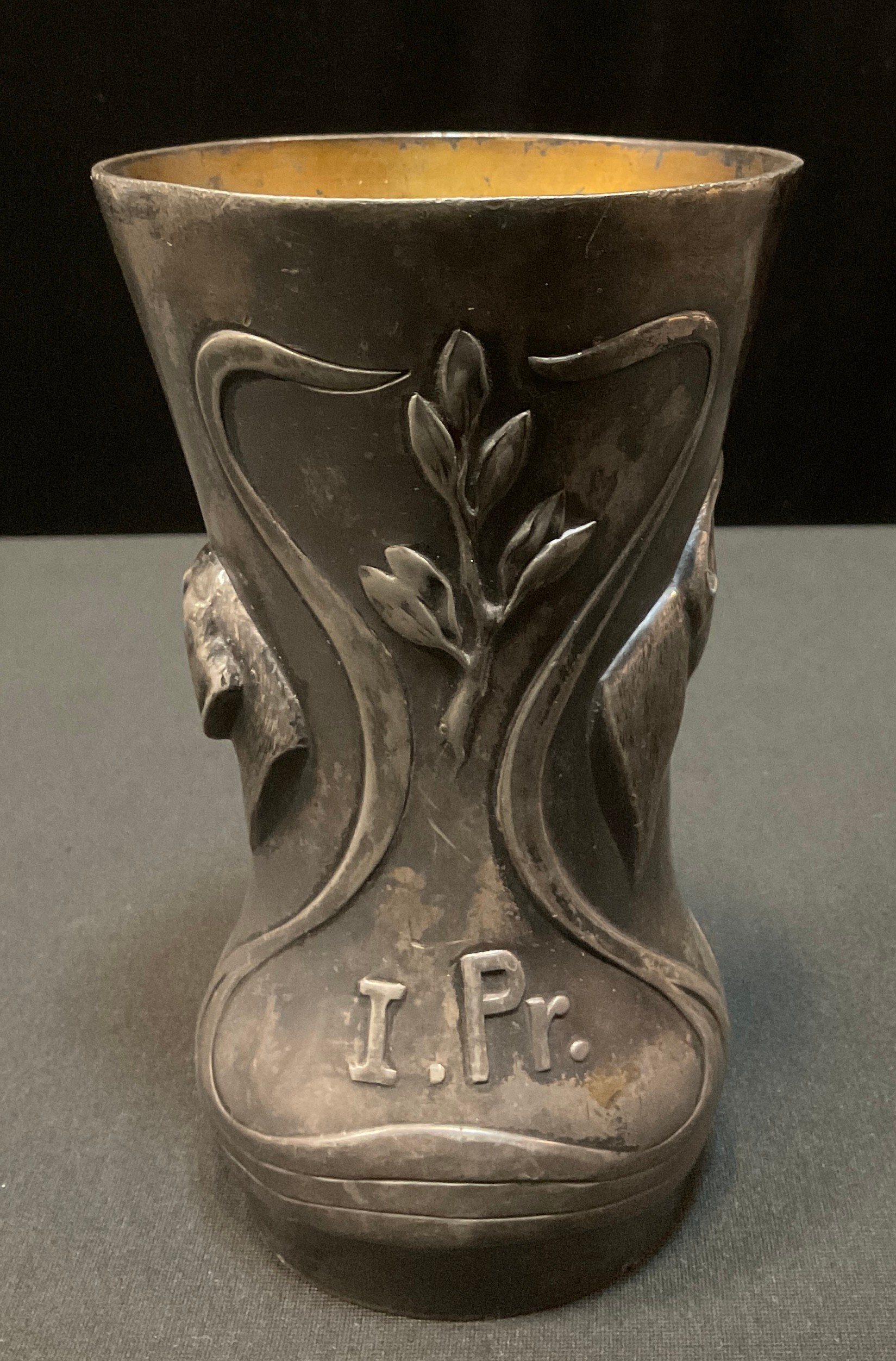 An early 20th century German pewter waisted cylindrical vase, embossed with sinuous scrolls, flowers - Image 4 of 4