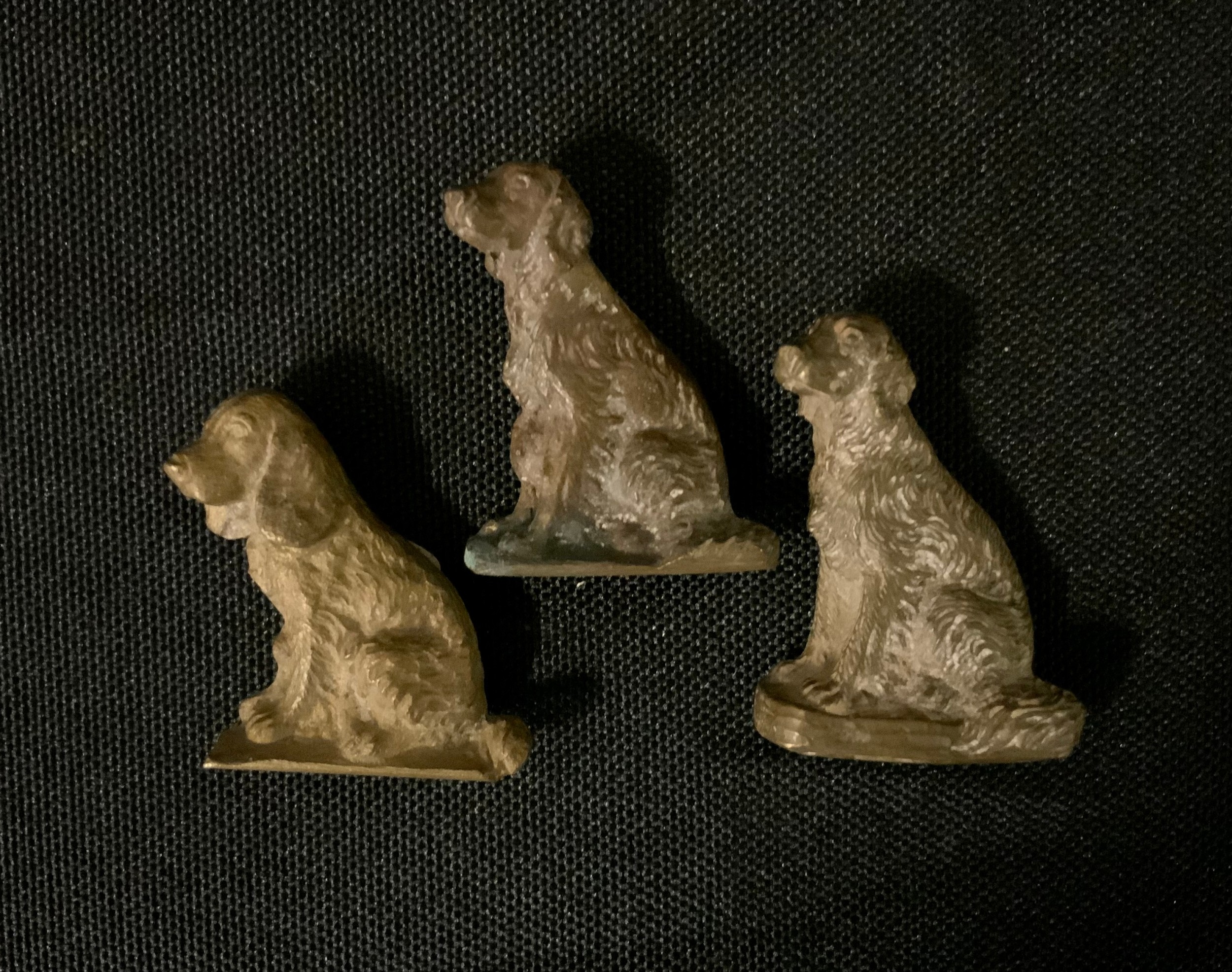 An Austrian miniature bronze, seated Retriever dog, 3.2cm high, impressed 5503; others similar