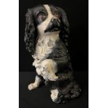 A 19th century novelty storage jar and cover, in the form of a King Charles Spaniel, 25cm high,