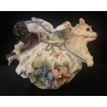 A Nove di Bassano faïence model, of a Pug and Spitz, in a lady's cloth purse, decorated with