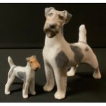 A Royal Copenhagen model of a Fox Terrier, 15.5cm high, printed mark, 2967; another, 3170 (2)