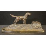 An Austrian gilt bronze desk stand, cast with a Setter, well and pen aperture, 27cm wide, c.1910