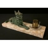 An early 20th century French side light, with green spelter Belgium Shepherd dog, reclining,
