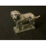 A Louis LeJeune silver plated car mascot, of a Toy Spaniel, rectangular base, 7cm high. c.1910