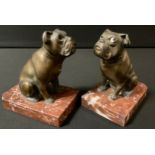 A pair of French spelter bookends, with seated Bulldogs, rouge marble bases, 13cm high
