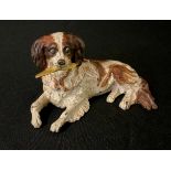 A 20th century painted bronze novelty inkwell, of a Toy Spaniel, reclining, 11.5cm wide