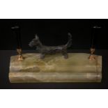 An Austrian desk stand, mounted with a bronzed terrier, shaped onyx base with two pen holders and