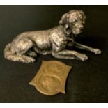 A German silver plated mode, possibly W.M.F., of a St Bernard, reclining, 16cm wide, c.1920; a St