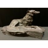 Continental School, a dark patinated bronze, Borzoi, reclining, shaped base, signed Sucek, c.1930