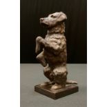 German School, c.1920, a brown patinated bronze, of a Fox Terrier, begging, square base,