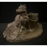 A late 19th century French spelter inkwell, cast with hound seated by a coopered pail, 14.5cm