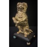 English School, late 19th century, a gilt bronze, Rough Haired Terrier, begging, glass eyes,