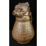 A late 19th century French salt glazed stoneware cider jug, in the form of Pug, it's mouth as the