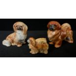 A Royal Worcester novelty menu holder, as a Pekingese, 2.5cm high, printed mrk in black, model no.