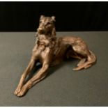 English School, 19th century, Messengers, London, a gilt bronze, Deerhound, reclining, 11cm high,