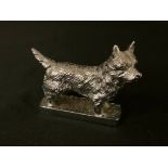 A 20th century Louis Lejeune silvered car mascot, of a Rough Haired Terrier, rectangular base, 9cm