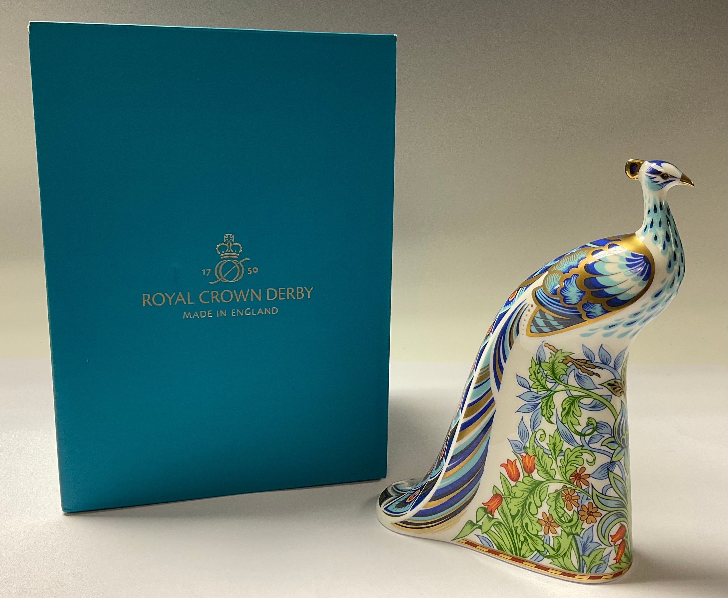 A Royal Crown Derby paperweight, Manor Peacock, gold stopper, 19cm, printed mark, boxed