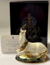 A Royal Crown Derby paperweight, New Millennium Unicorn, limited edition, 855/2,000, 14cm long, gold