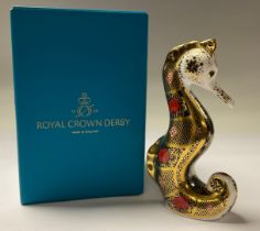 A Royal Crown Derby paperweight, Old Imari Solid Gold Band Seahorse, gold stopper, 16cm, printed
