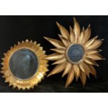 Interior Decoration - a gilt metal wall mirror, as a stylised flowerhead, circular bevelled plate,