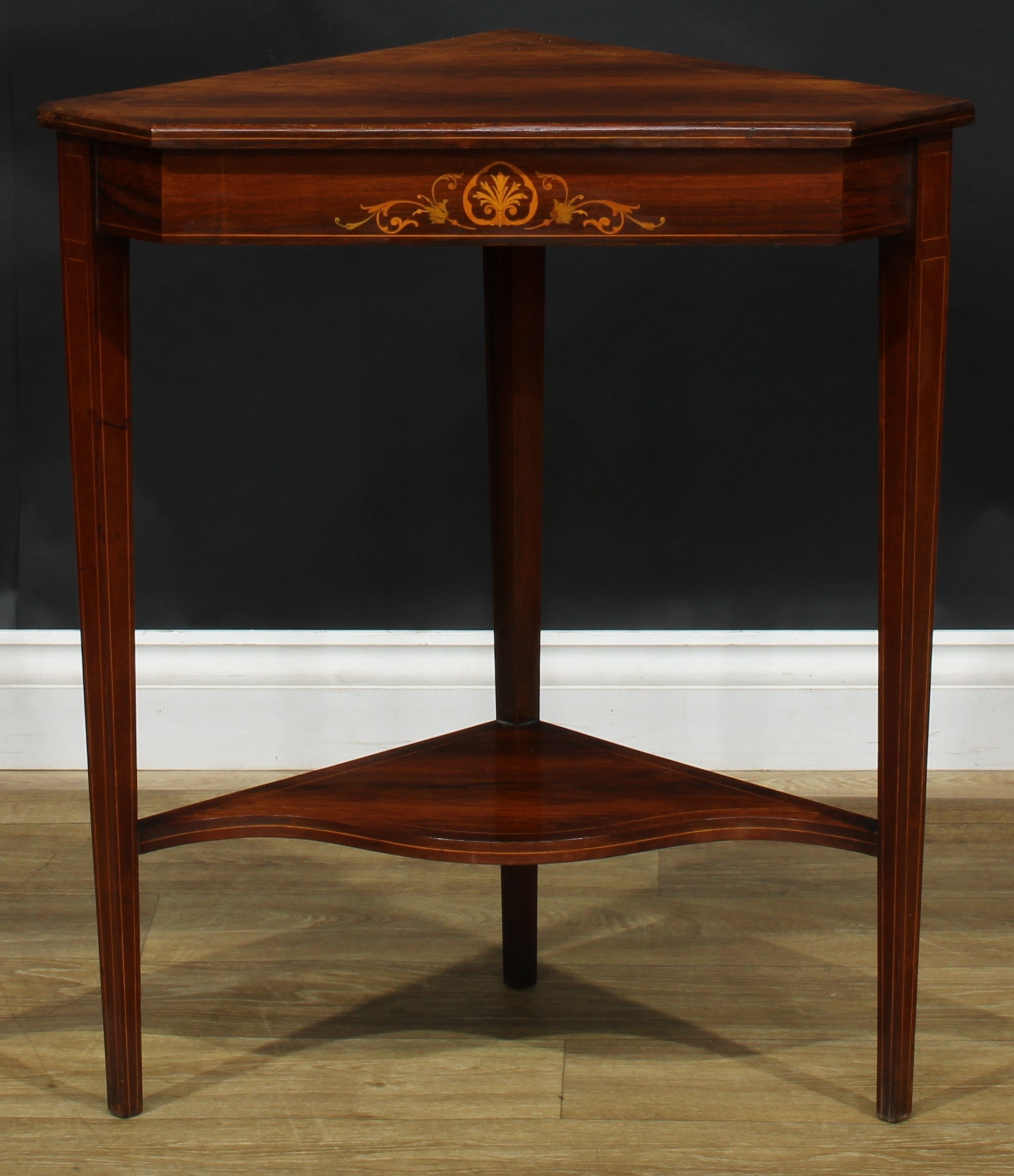 An Edwardian rosewood and marquetry corner table, 73cm high, 64.5cm wide, 41cm deep