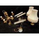 Lighting - a brass five branch electrolier; a set of three brass picture lights; a pair of brass