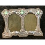 A small Art Nouveau style enamelled sterling silver double photograph frame, impressed sterling,