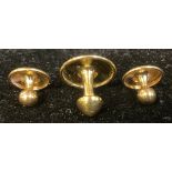 A set of three 18ct gold studs, 3.1g, boxed