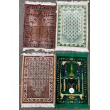 An Islamic woollen prayer mat/rug, depicting a mosque in shades of green and yellow, with a