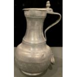 A 19th century French pewter beer jug, the hinged cover with acorn thumbpiece, 34cm, impressed