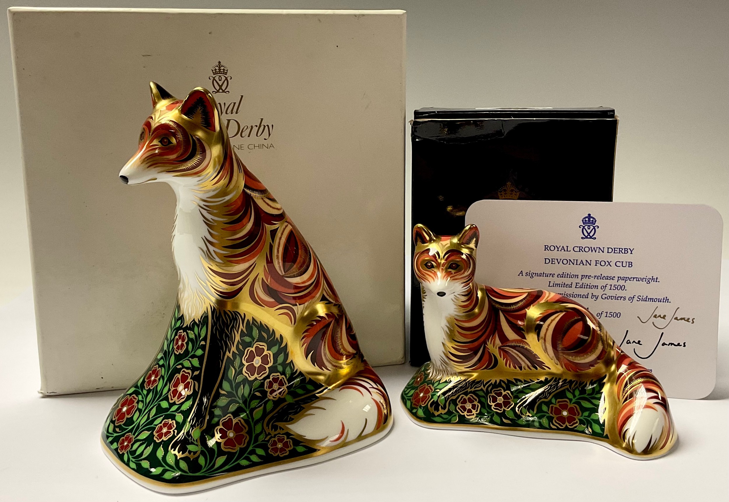 A Royal Crown Derby paperweight, Vixen, gold stopper, associated box; another, Devonian Fox Cub,