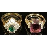 A 14k dress ring set with purple and clear paste stones, size N, 4.2g; another 14k dress ring set