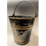 A gilt and black painted bucket, in the toleware manner, 32cm high