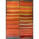 A Turkish woollen rug/runner, in bands of red, orange and ochre, 79cm wide, 208cm long; another,
