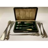 A George V silver manicure set, Birmingham 1922; silver shoe horns, various dates and makers; etc