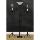 A pair of 17th century style metal floor lamps, 149cm high to top of simulated candle; another,