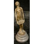 A dark patinated bronzed figure, of a lady holding a tray, approx. 19cm high