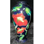 An Anne Rowe inverted baluster Poppy pattern tubelined vase, 27cm high