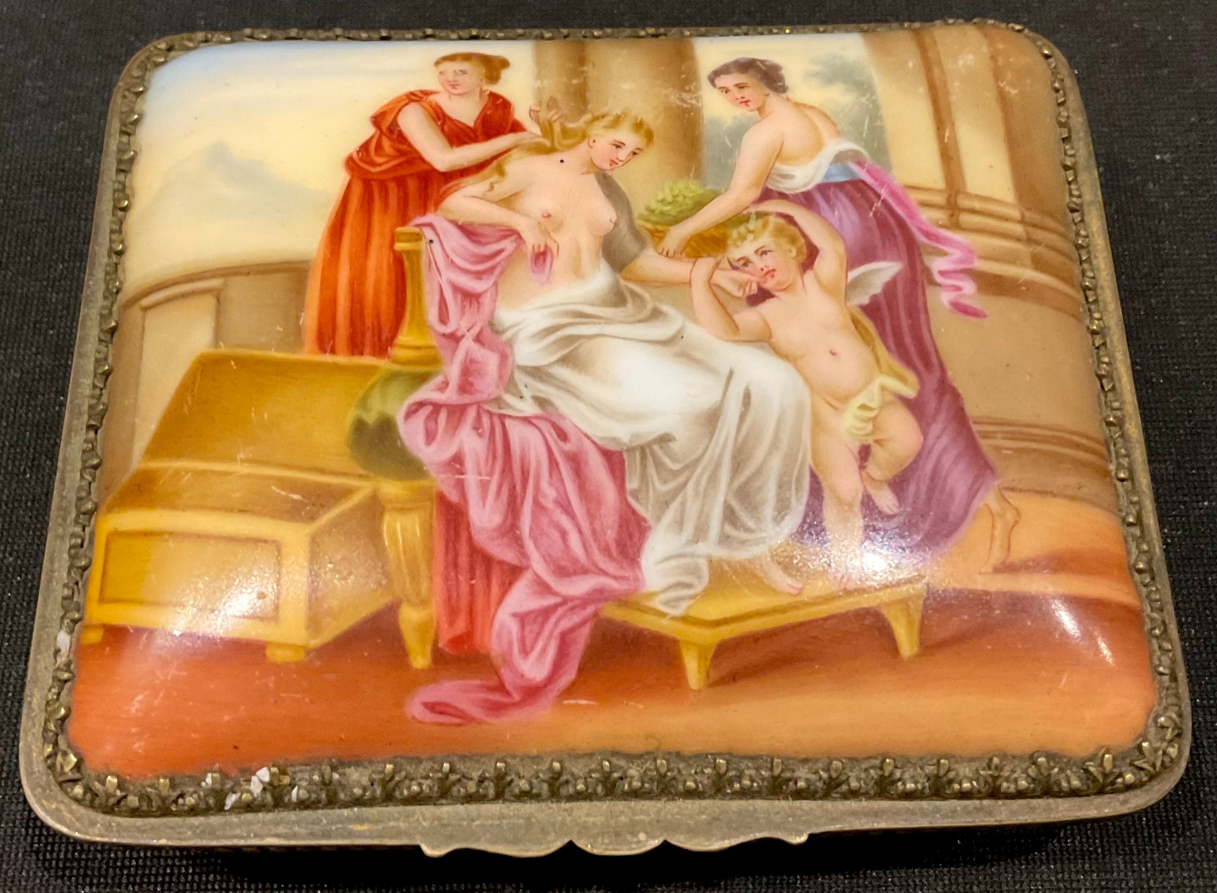 A 19th century French porcelain rounded rectangular box and cover, the slightly domed cover