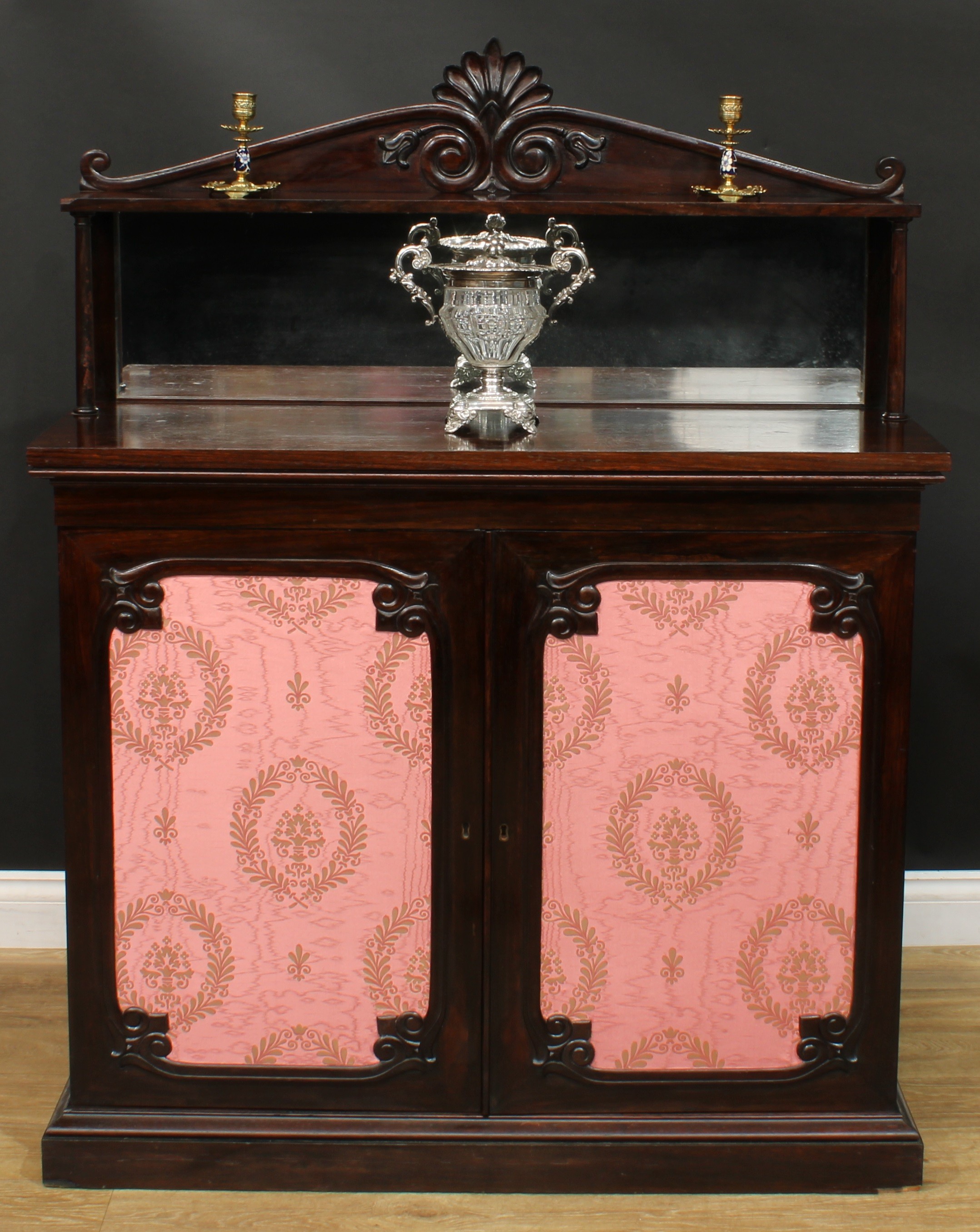 An early Victorian rosewood chiffonier, shaped superstructure with rectangular mirror, the base with